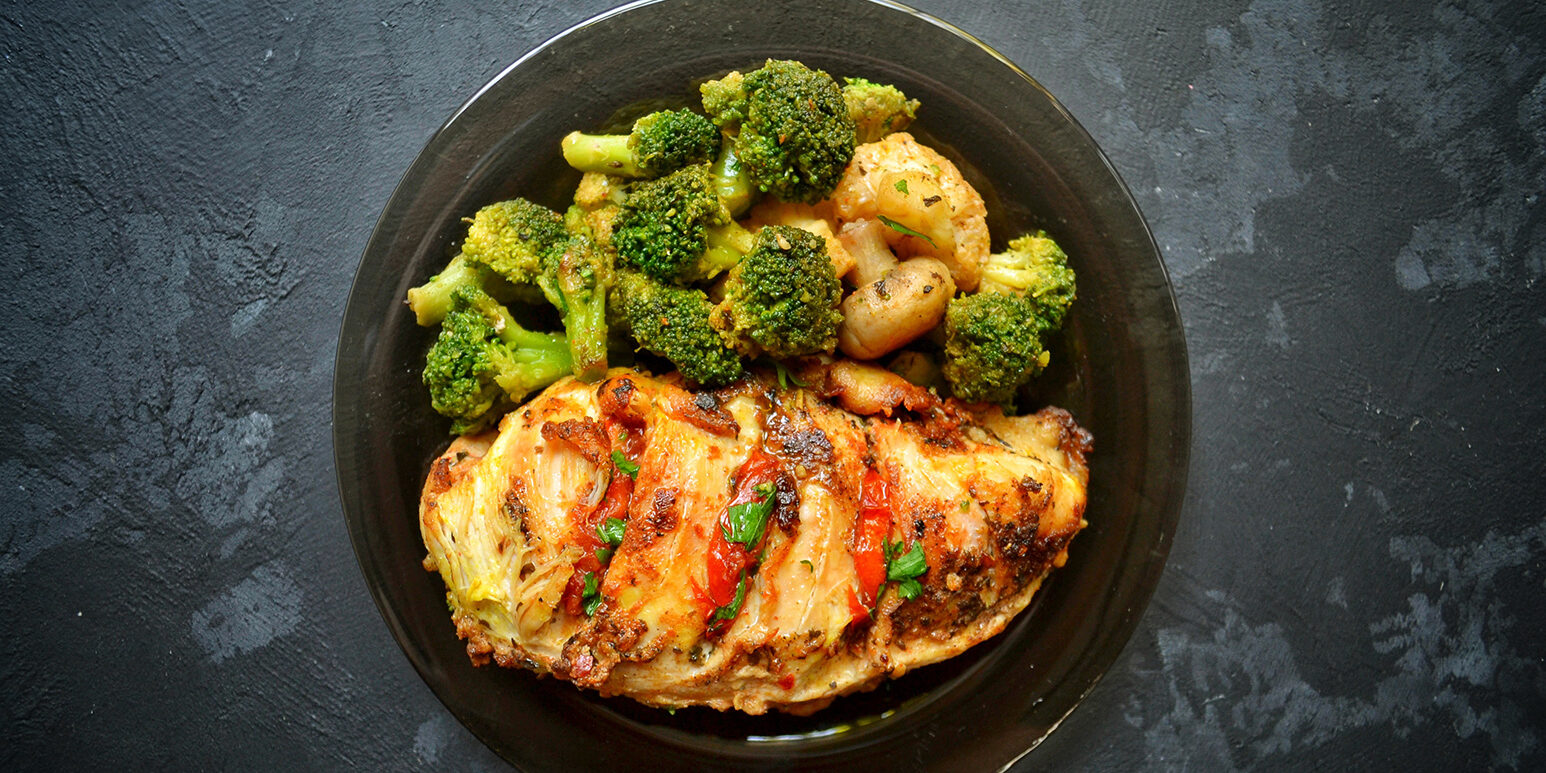 Fried chicken fillet. Broccoli and cauliflower. Baked chicken br