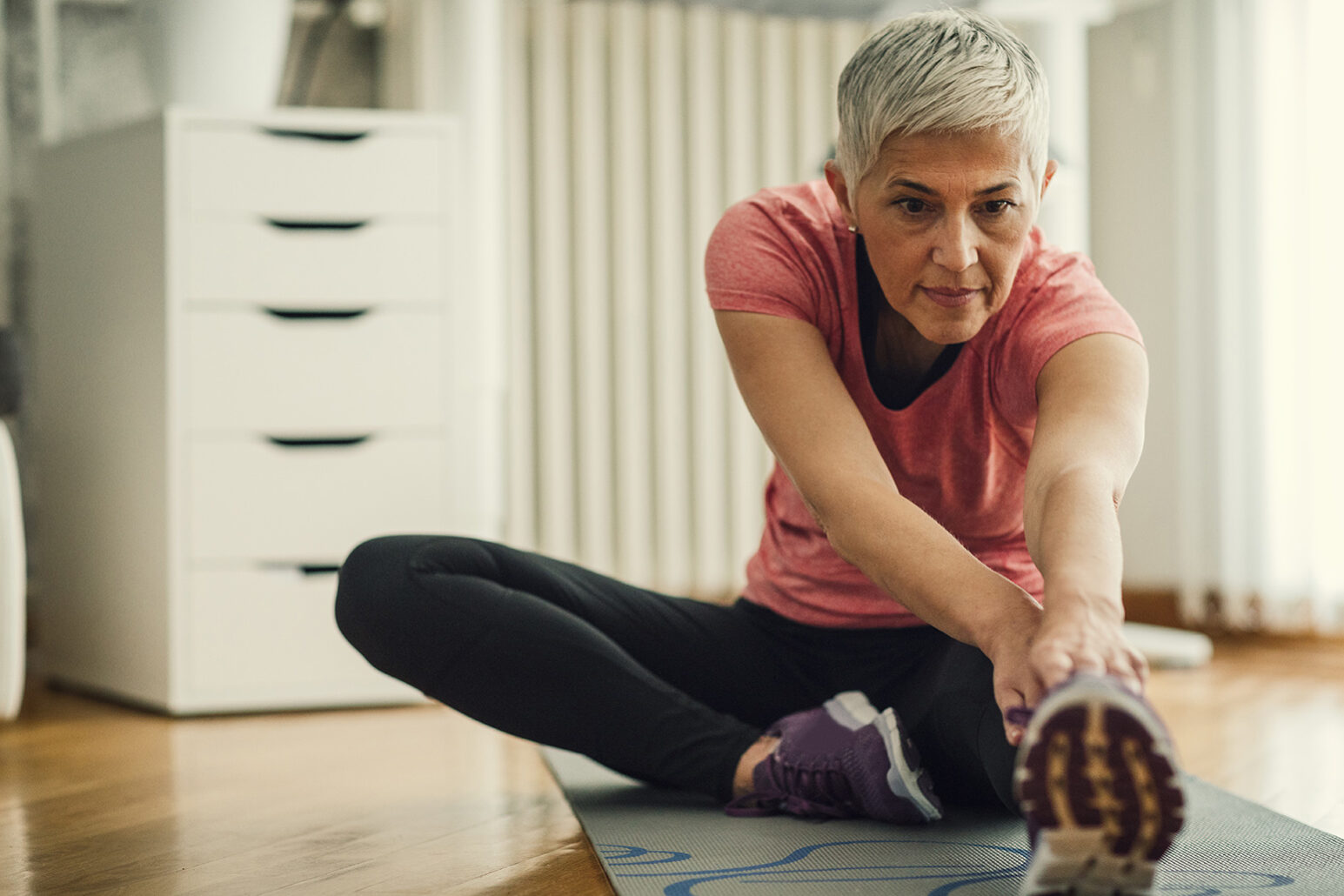 Mature Woman Exercise At Home.