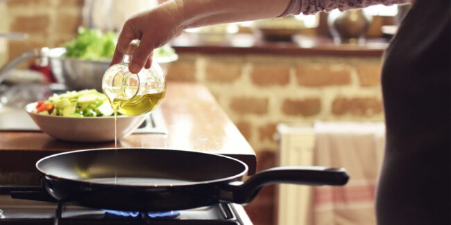 Cooking vegetables, step four, pouring the olive oil