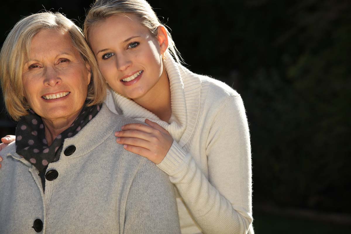Lung Cancer Treatment with smiling mom and daughter