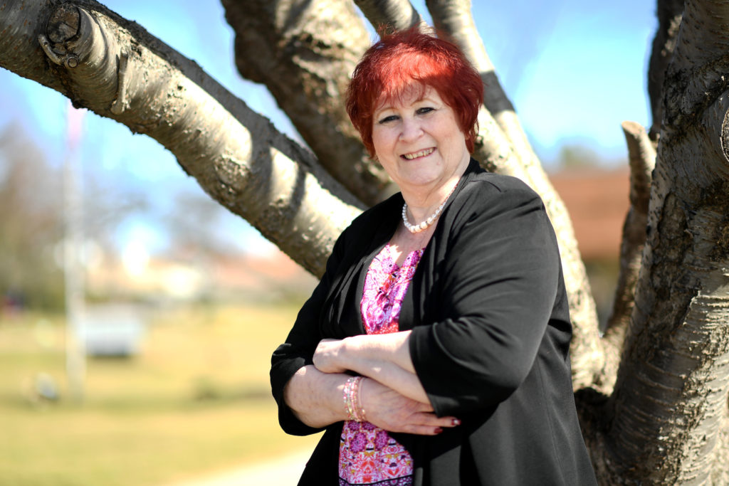 Bone and Spine Tumor Treatment-happy woman near a tree