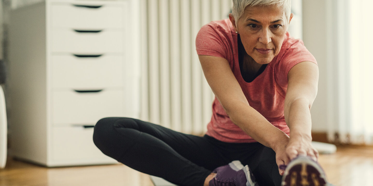 Mature Woman Exercise At Home.