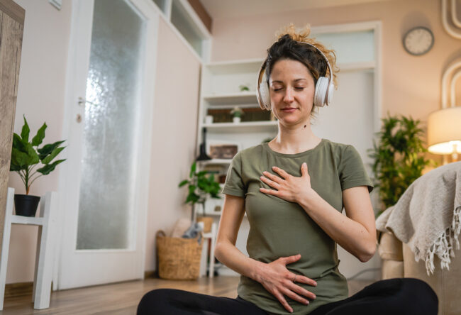 One woman sit on the floor practice online guided meditation sel