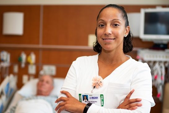 nurse standing with patient