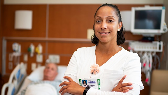 nurse standing with patient