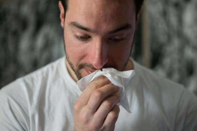 tissue Man wiping nose with tissue