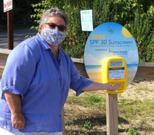 Port Jefferson Village Mayor Margot Garant with sunscreen dispenser