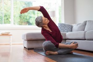 woman stretching to relieve sciatica pain