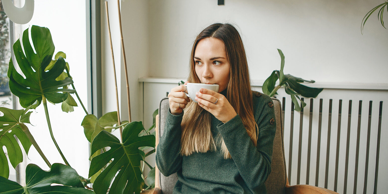 Girl drinks a hot drink