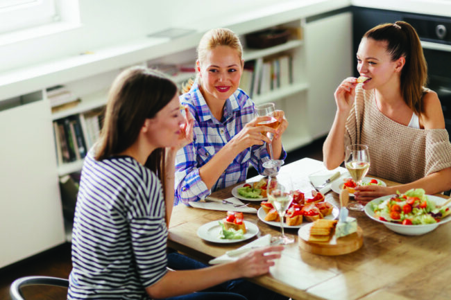 Photo of three young women enjoying time together