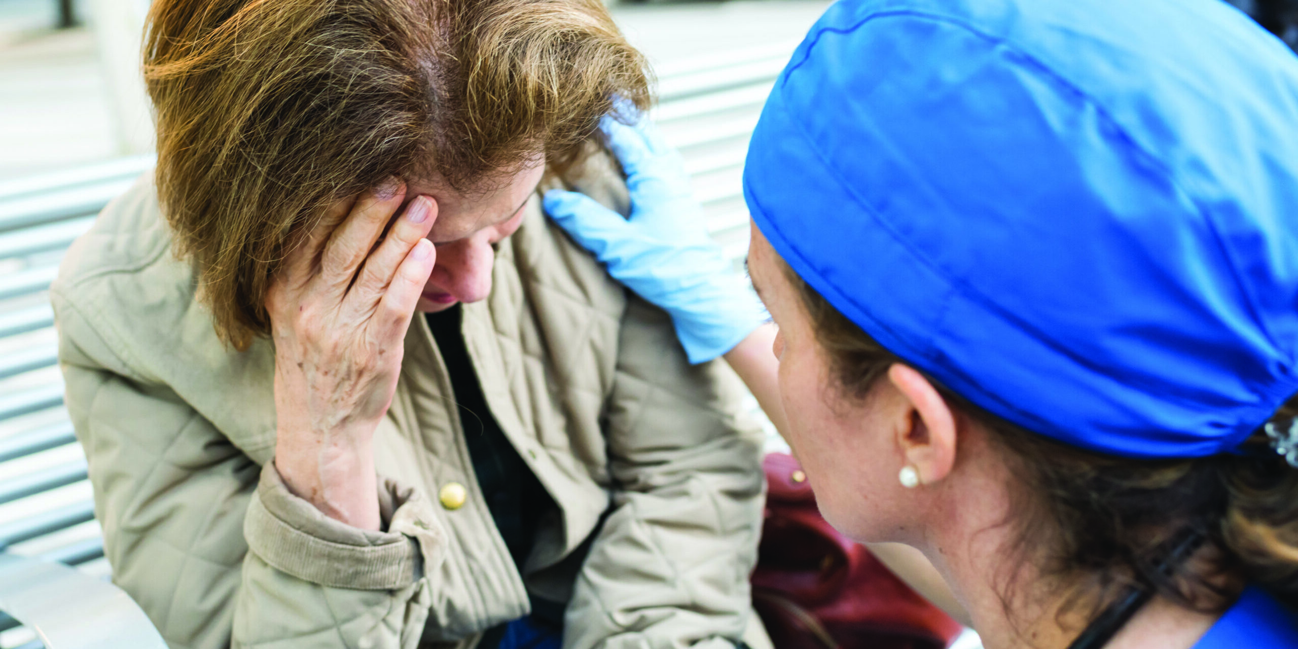 Female doctor assisting a senior woman