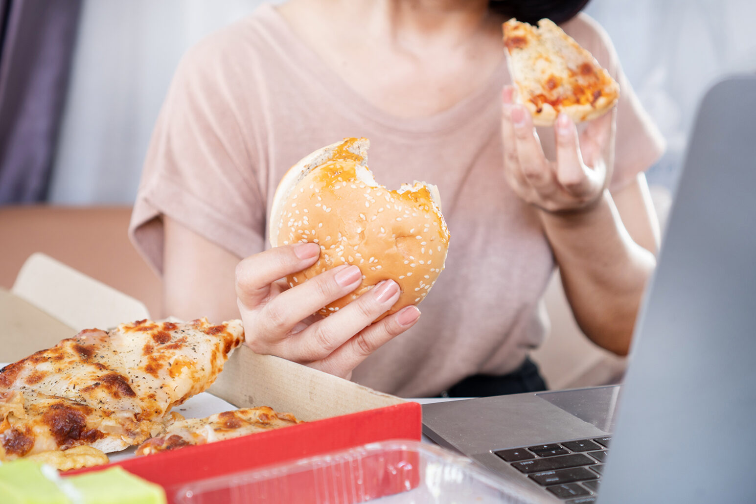 Binge Eating Disorder concept with woman over eating Fast Food B