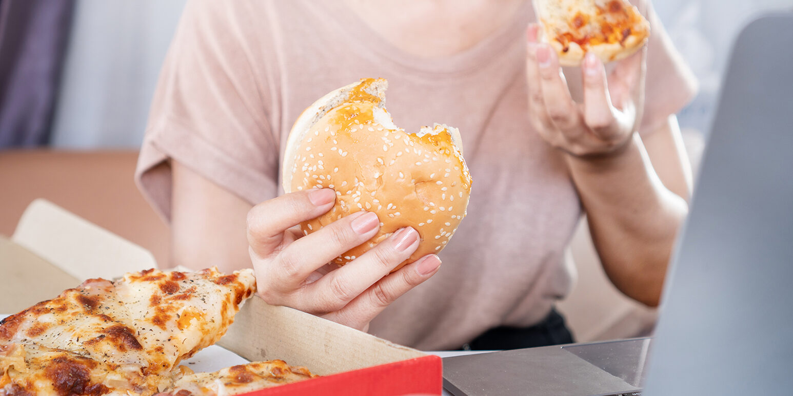 Binge Eating Disorder concept with woman over eating Fast Food B